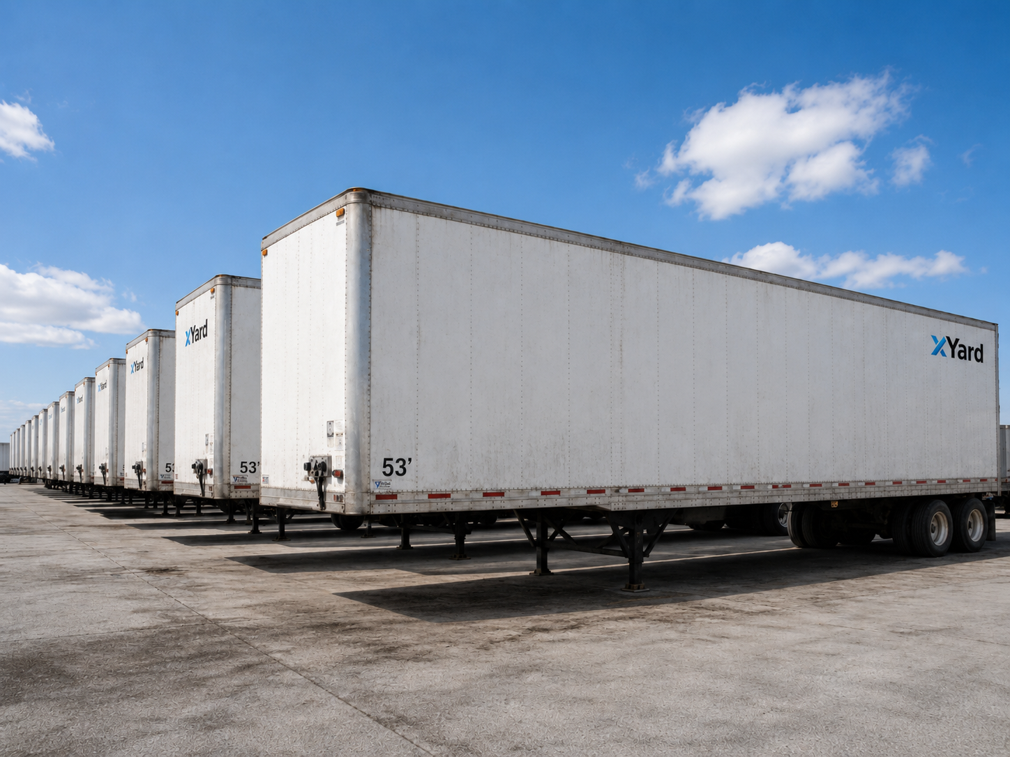 Row of xYard branded 53-foot trailers lined up at a yard facility